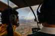 © Marcos Osorio/Stocksy - View of rainbow from inside a helicopter through the window