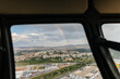 © Marcos Osorio/Stocksy - View of rainbow from inside a helicopter through the window