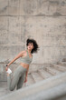 © Nuria Seguí/Stocksy - Fit Woman stretching on the street