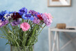 Bouquet of beautiful cornflowers in vase at home, closeup