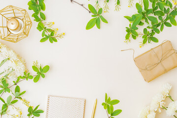 Wall Mural - flat lay composition with branches and green leaves, gift box, flowers on color background