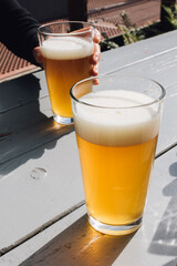 two glasses of beer on table