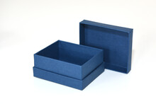 Mini Gift Box In Blue Color Made Of Designer Paper On A White Background With An Open Lid