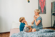 © Olga Moreira/Stocksy - Mother and her 5 years old kid meditating in bed