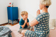 © Olga Moreira/Stocksy - Mother and her 5 years old kid meditating in bed