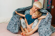 © Olga Moreira/Stocksy - Mom and her 5 years old son playing in bed