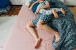 © Olga Moreira/Stocksy - Anonymous mother and son in bed