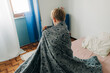 © Olga Moreira/Stocksy - 5 years old boy wrapped in blanket