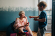 © Olga Moreira/Stocksy - Mother and son eating strawberries