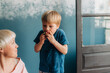 © Olga Moreira/Stocksy - Mother and son eating strawberries