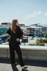 Canvas Print - Elegant female from Bosnia and Herzegovina posing on the roof