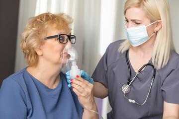 Wall Mural - Elderly woman at doctor during coronavirus pandemic