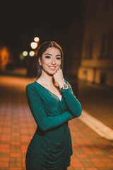 Canvas Print - Young sexy Caucasian girl standing in the street and leaning on her hand