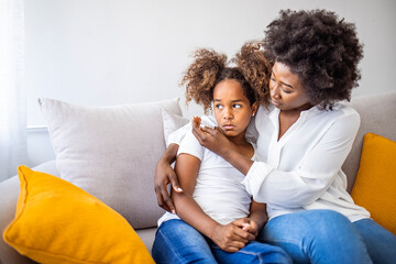 Wall Mural - Worried young foster care parent mother comforting solacing embrace adopted little child daughter give care and protection at home, loving concerned adult mom hug sad small girl consoling kid concept