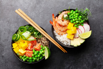 Wall Mural - Poke bowls with shrimps, salmon, avocado and mango