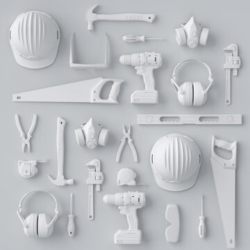 Top view of monochrome construction tools for repair and installation on white