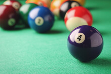 Billiard Ball With Number 4 On Green Table, Closeup. Space For Text