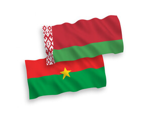 National vector fabric wave flags of Burkina Faso and Belarus isolated on white background. 1 to 2 proportion.