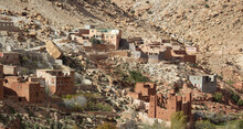 Mudbrick Village In The High Atlas Mountains With Red And White Houses