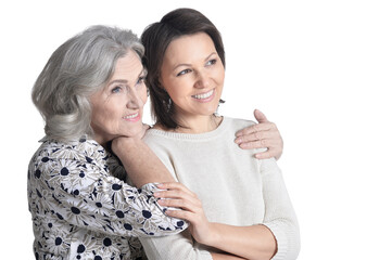 portrait of mother and her adult daughter  isolated on white