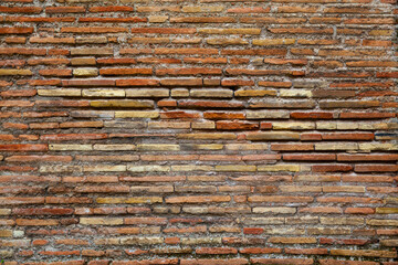 Ancient brickwork of flat roman bricks