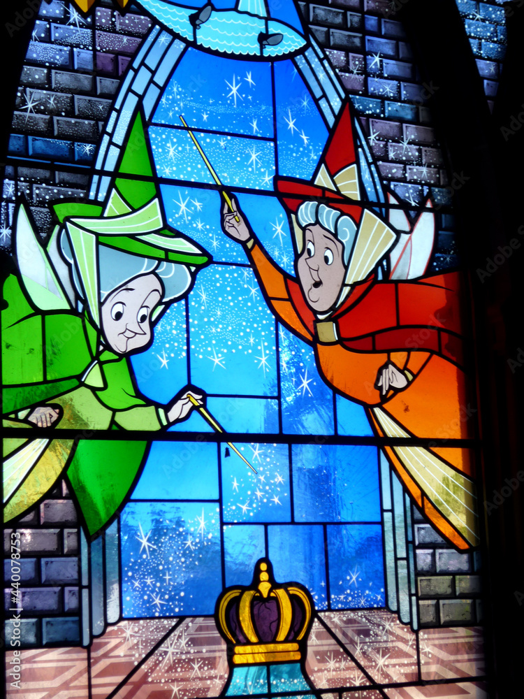 Stained glass window of the film fairies Sleeping Beauty from Walt Disney. Stained glass window of the Disneyland Paris castle. Euro Disney. The magic of Disney. Magical and kind fairy characters.
