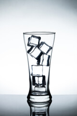 Ice in glass on white background