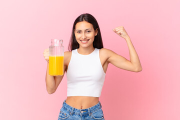 pretty hispanic woman with an orange juice. breakfast concept