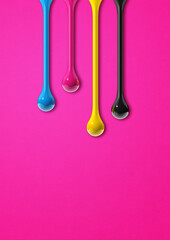 Wall Mural - cmyk ink drops on pink paper background