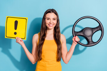 Sticker - Photo portrait girl keeping steering wheel showing road sign isolated pastel blue color background