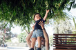 © Ashley Corbin-Teich/Westend61 - Cute boy touching tree leaves while lifted by father