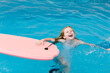 © LIGHTSY STUDIO/Westend61 - Cheerful girl playing in swimming pool
