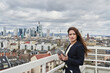 © Annika List/Westend61 - Mid adult female entrepreneur looking away while standing on rooftop