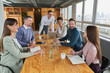 © Annika List/Westend61 - Colleagues listening to businesswoman in meeting at board room