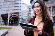 © Angel Santana Garcia/Westend61 - Smiling female professional holding digital tablet while looking away