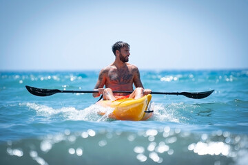 Man kayaking on the beach during summer vacation