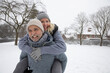 © Frank van Delft/Westend61 - Senior man piggybacking woman at park during winter