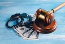 Handcuffs, Money And The Judge's Hammer