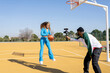 © Jose Carlos Ichiro/Westend61 - Happy male and female vlogging with basketball on sports court
