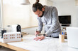© Jose Carlos Ichiro/Westend61 - Male architect designing construction plan while working at home