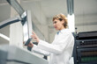 © Joseffson/Westend61 - Mature female scientist operating printing machine in laboratory