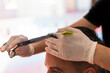 © Julio Rodriguez/Westend61 - Male hairdresser using scissor for cutting customer's hair at salon