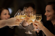 © Malte Jager/Westend61 - Male and female friends toasting wineglasses during birthday celebration at home
