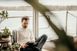 © Malte Jager/Westend61 - Businessman using digital tablet while working in houseboat