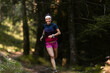 © Mikel Taboada/Westend61 - Happy young female sportsperson running in forest
