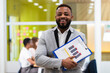 © NOVELLIMAGE/Westend61 - Young businessman with document paper on clipboard at office