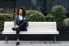 Contemplative Male Entrepreneur Sitting On Bench
