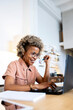 © Rafael Fernandez Torres/Westend61 - Businesswoman with eyeglasses working on laptop at home office