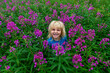 © Michael Runkel/Westend61 - Smiling girl amidst blooming flower field