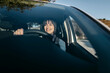 © Tania Cervian/Westend61 - Young woman driving car seen through windshield